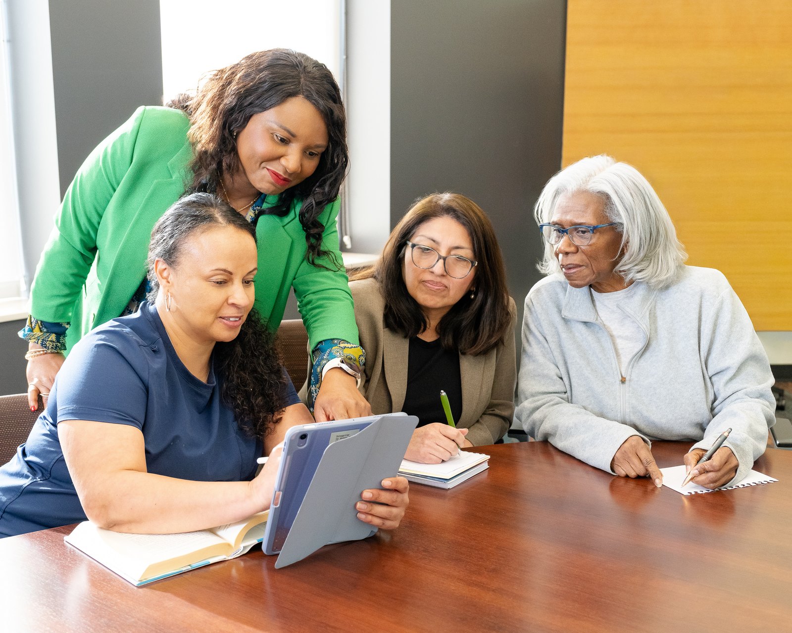 The care team meeting with a client to match the right Care Partner